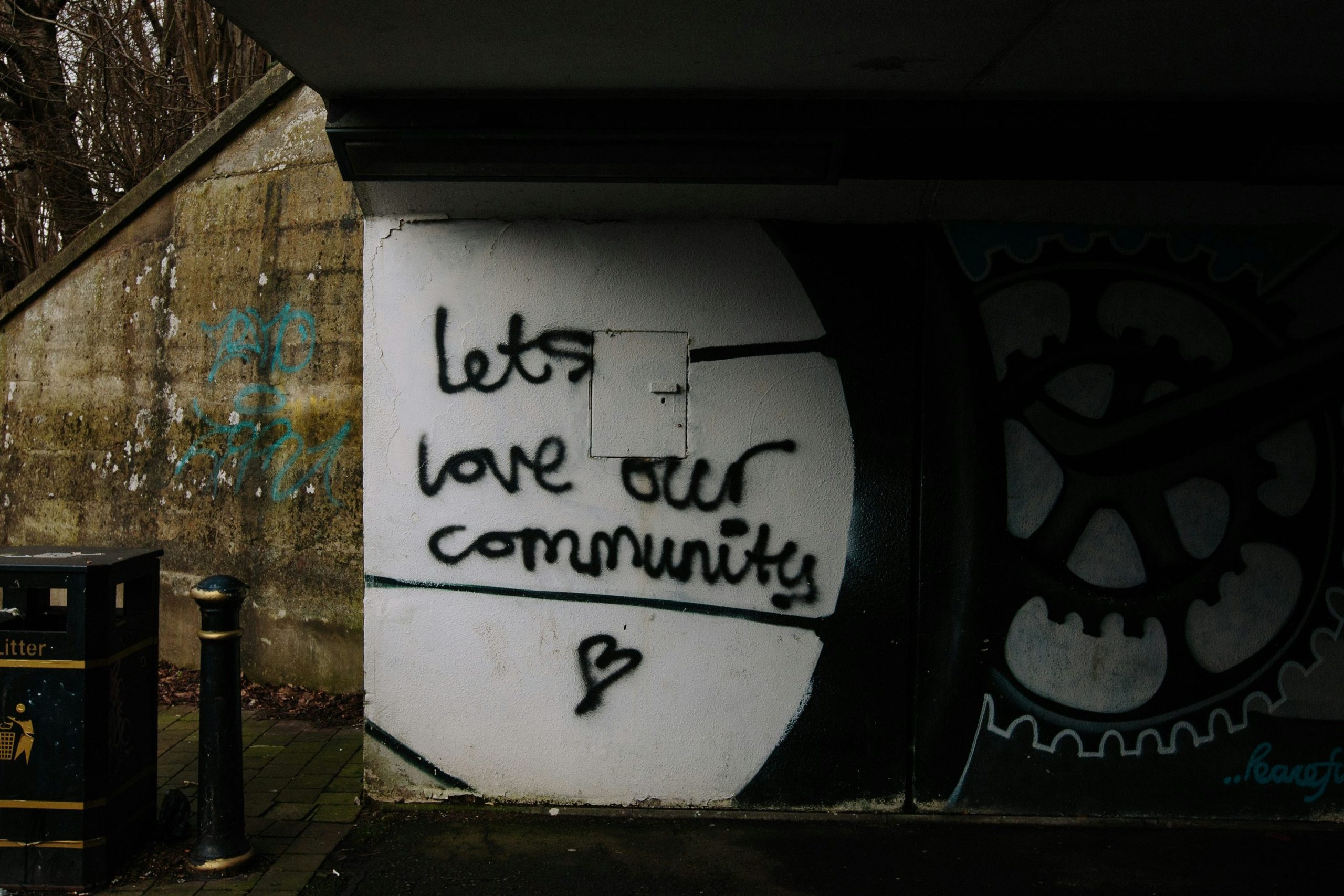 A photo of graffiti art saying "lets love our community"